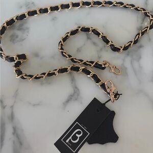 Black leather and gold bag strap